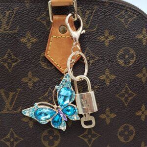 Authentic Louis Vuitton Lock & Key W/ Unbranded Elegant Blue Butterfly Keychain